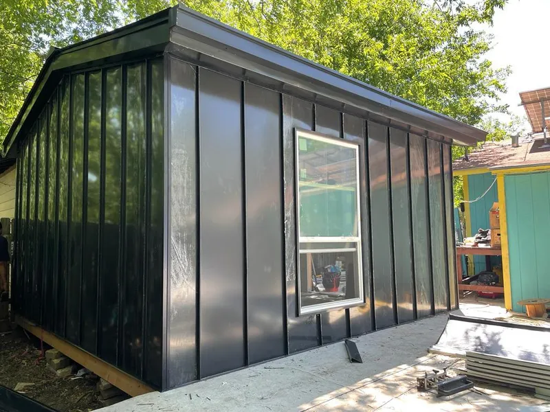 Black standing seam metal wall panels for Roof Inspection in Smithtown