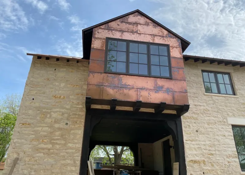 Copper metal panel facade on a stone building for Skylight Installation in Smithtown